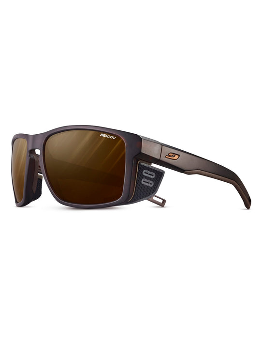 Okulary fotochromowe JULBO SHIELD - brązowy/czarny | Reactiv Polarized Cat 2-4 - L - Adventure Sports
Okulary fotochromowe JULBO SHIELD - brązowy/czarny | Reactiv Polarized Cat 2-4 - L - Adventure Sports