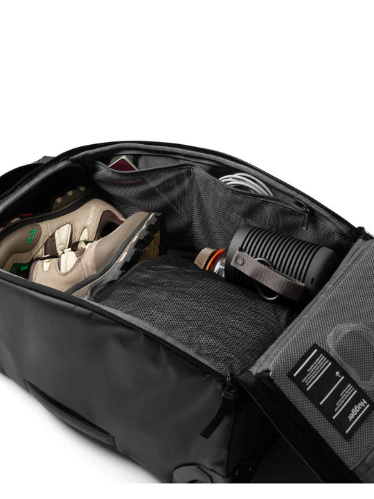 Torba podróżna na kółkach Db™ Hugger Roller Bag Carry-On 40L czarny
Torba podróżna na kółkach Db™ Hugger Roller Bag Carry-On 40L czarny