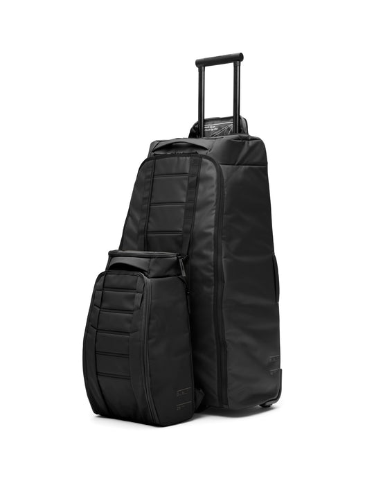 Torba podróżna na kółkach Db™ Hugger Roller Bag Check-In 90L niebieski
