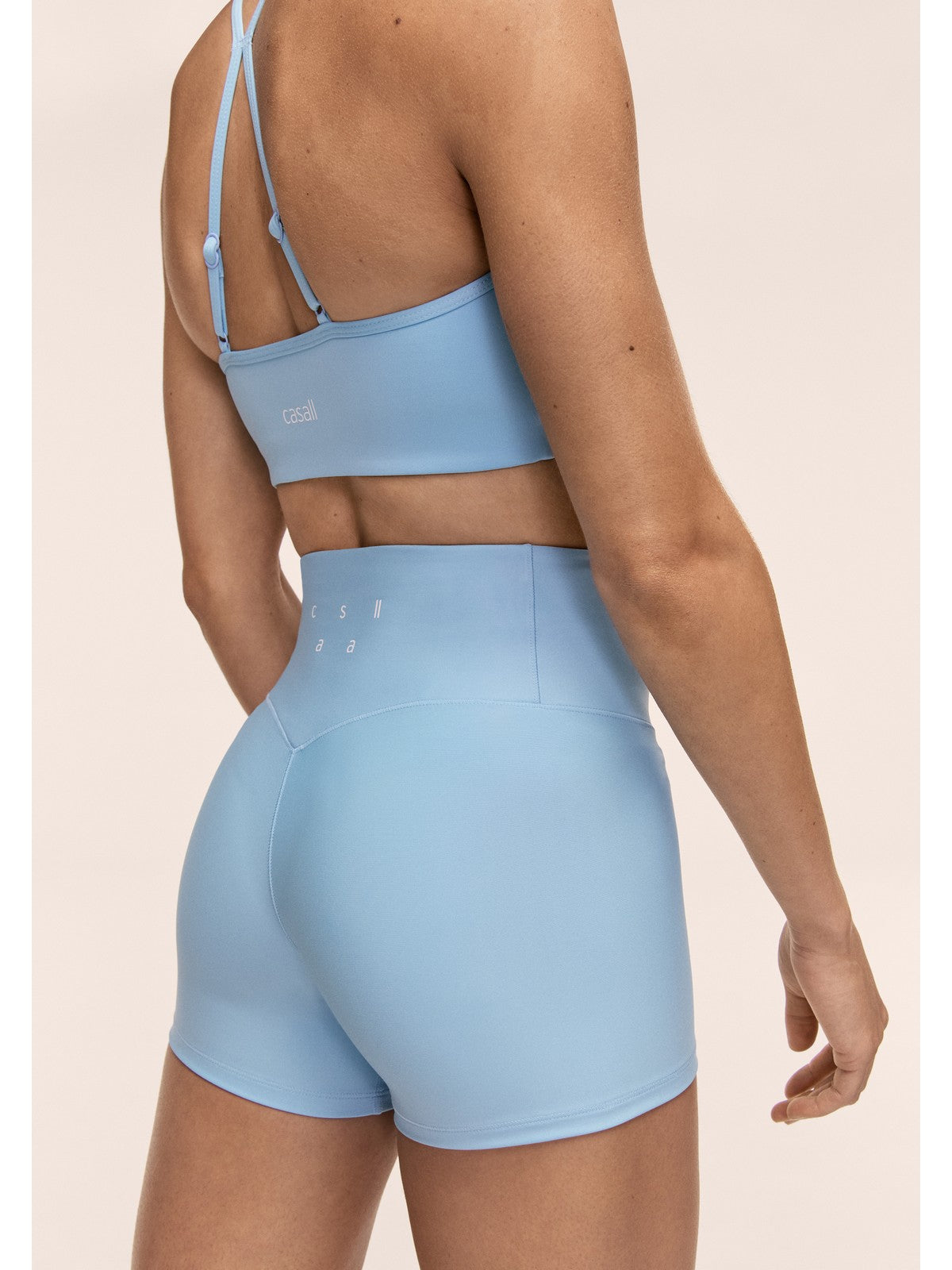 Stanik sportowy CASALL Sleek Strappy Sports Bra kolor niebieski