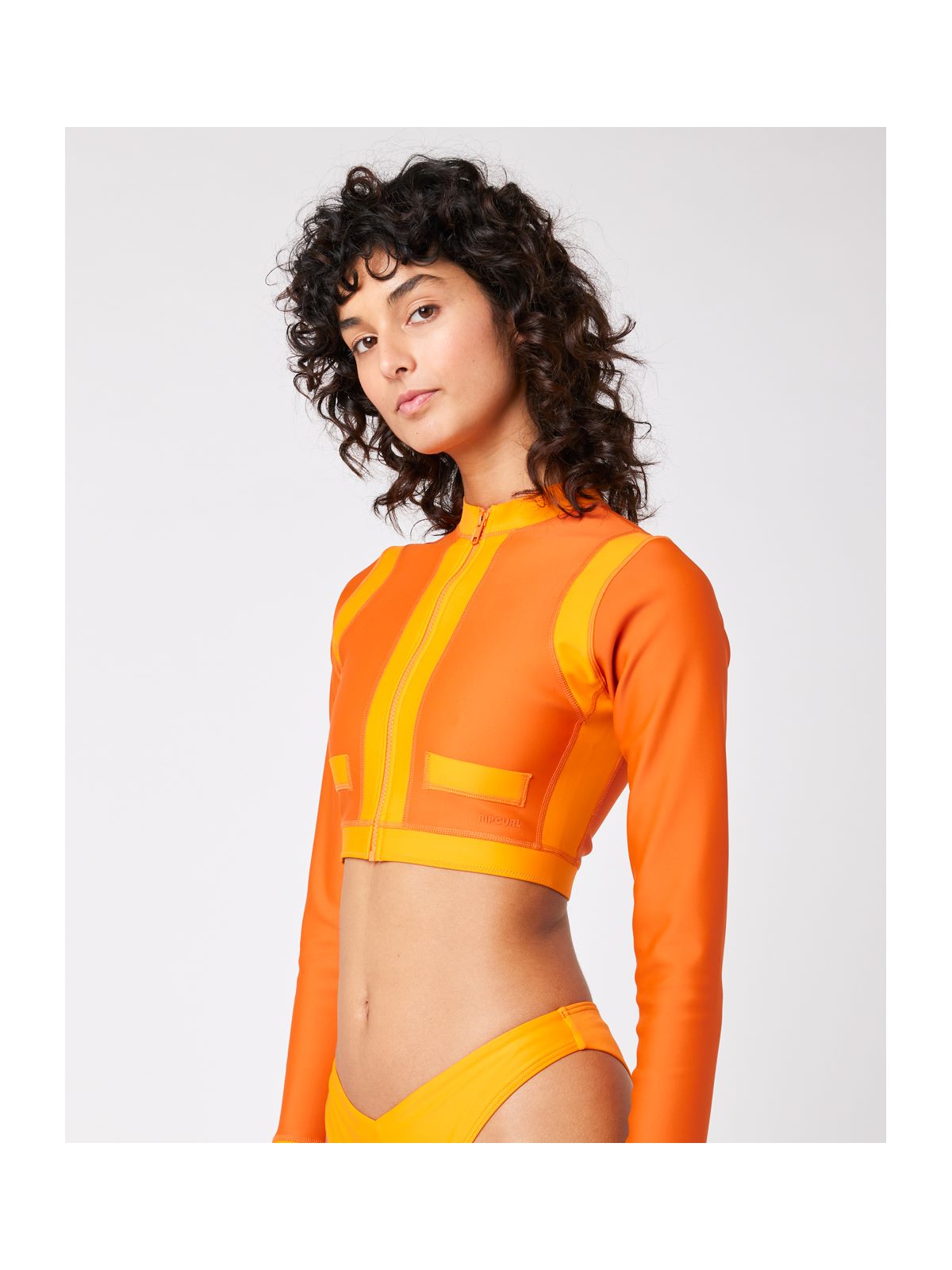 Top RIP CURL Mirage Coco Ls Crop Zipped pomarańczowy - Adventure Sports