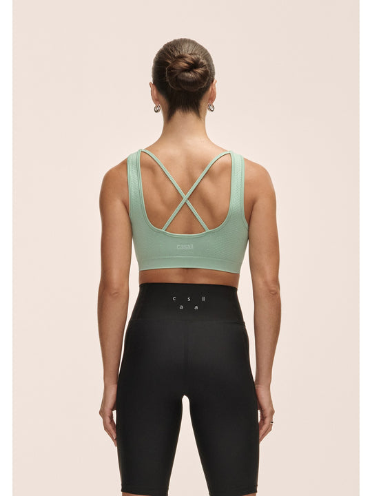 Top damski treningowy Casall Scallop Seamless Bralette zielony - Adventure Sports
