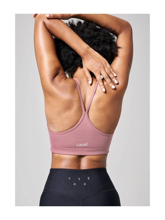 Stanik treningowy CASALL Strappy Sports Bra różowy - Bielizna - Adventure
