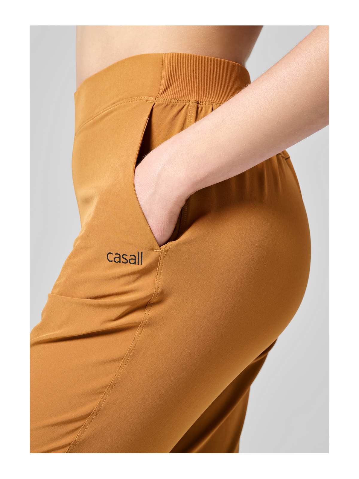 Spodnie CASALL Slim Woven Pants żółty - Adventure Sports