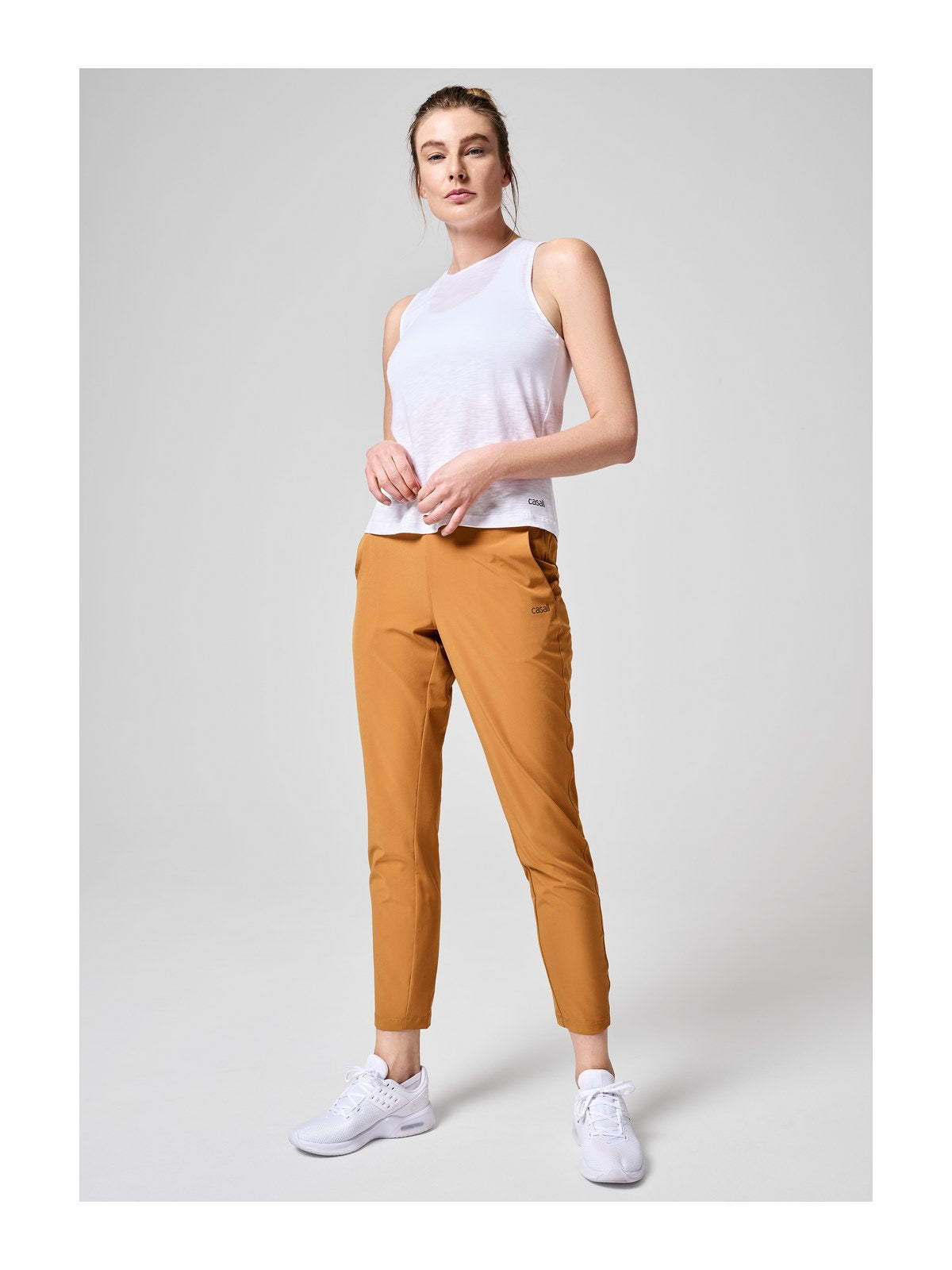 Spodnie CASALL Slim Woven Pants żółty - Adventure Sports
